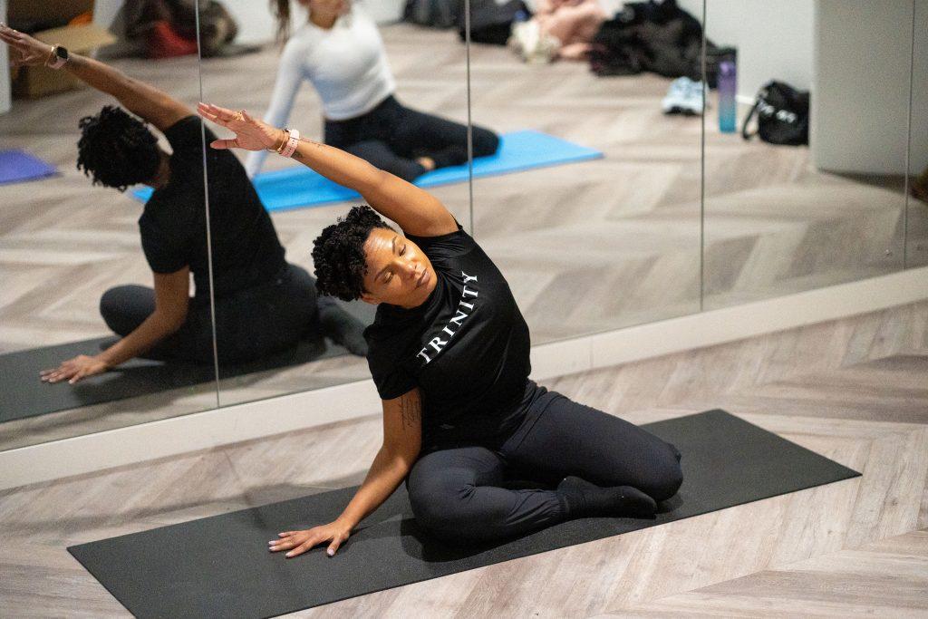 One of our Trinity coaches shows us a great example of how to prevent menopause weight gain by performing a side flexion stretch.